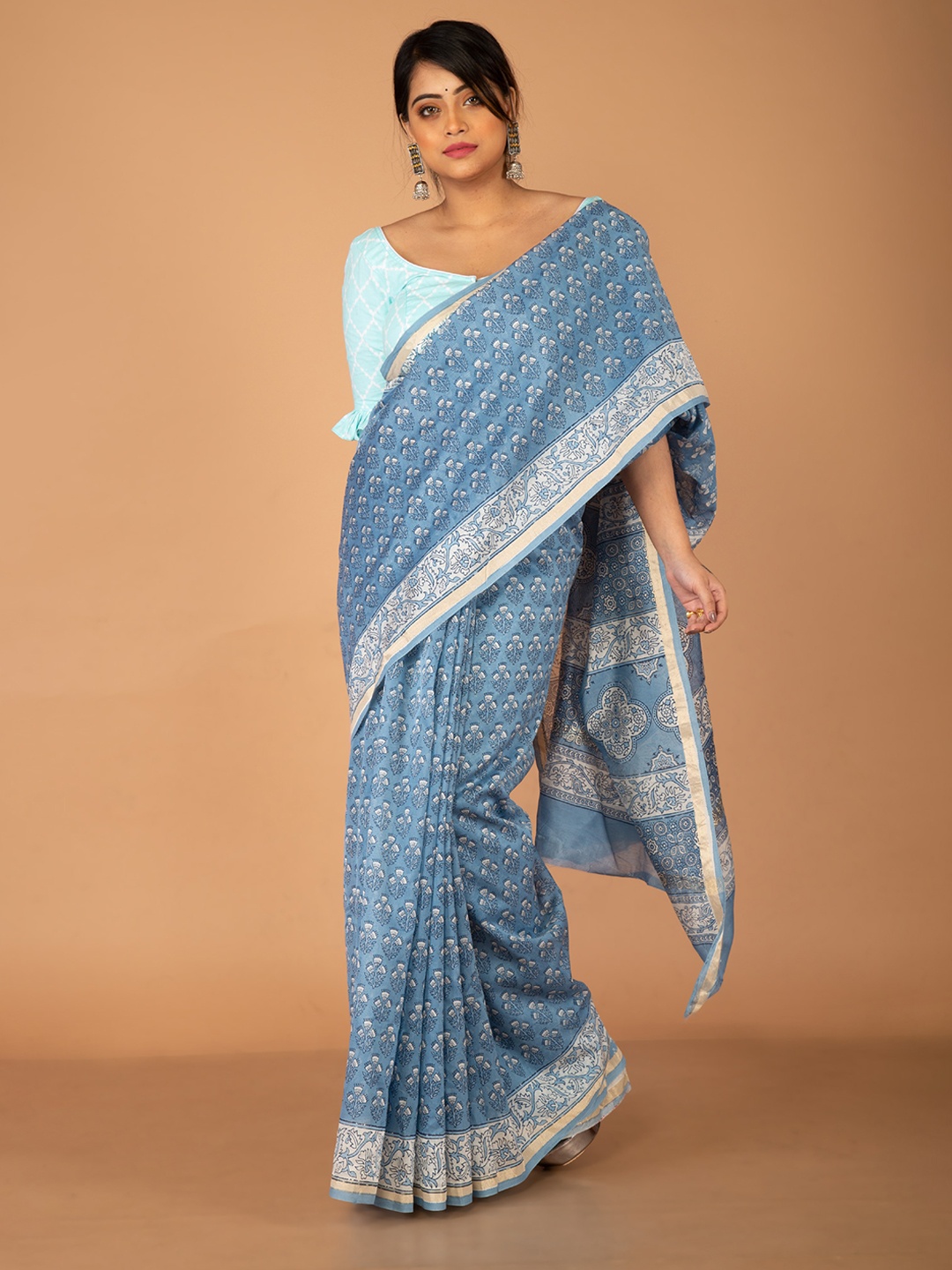 

Unnati Silks Blue & White Ethnic Motifs Silk Cotton Chanderi Saree