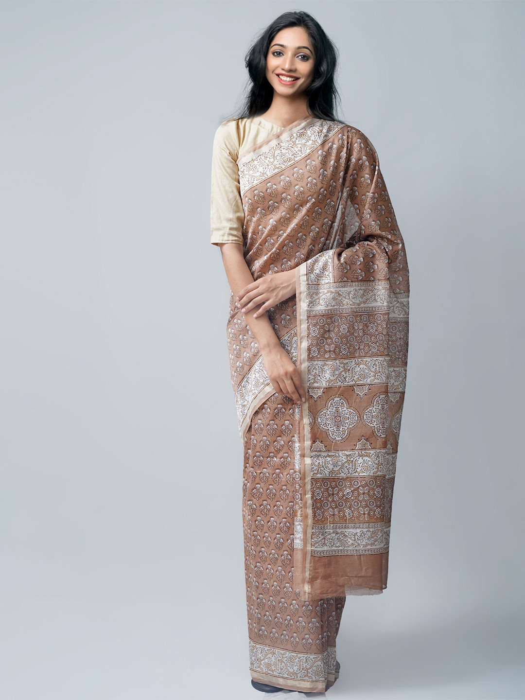 

Unnati Silks Brown & White Ethnic Motifs Zari Silk Cotton Chanderi Saree
