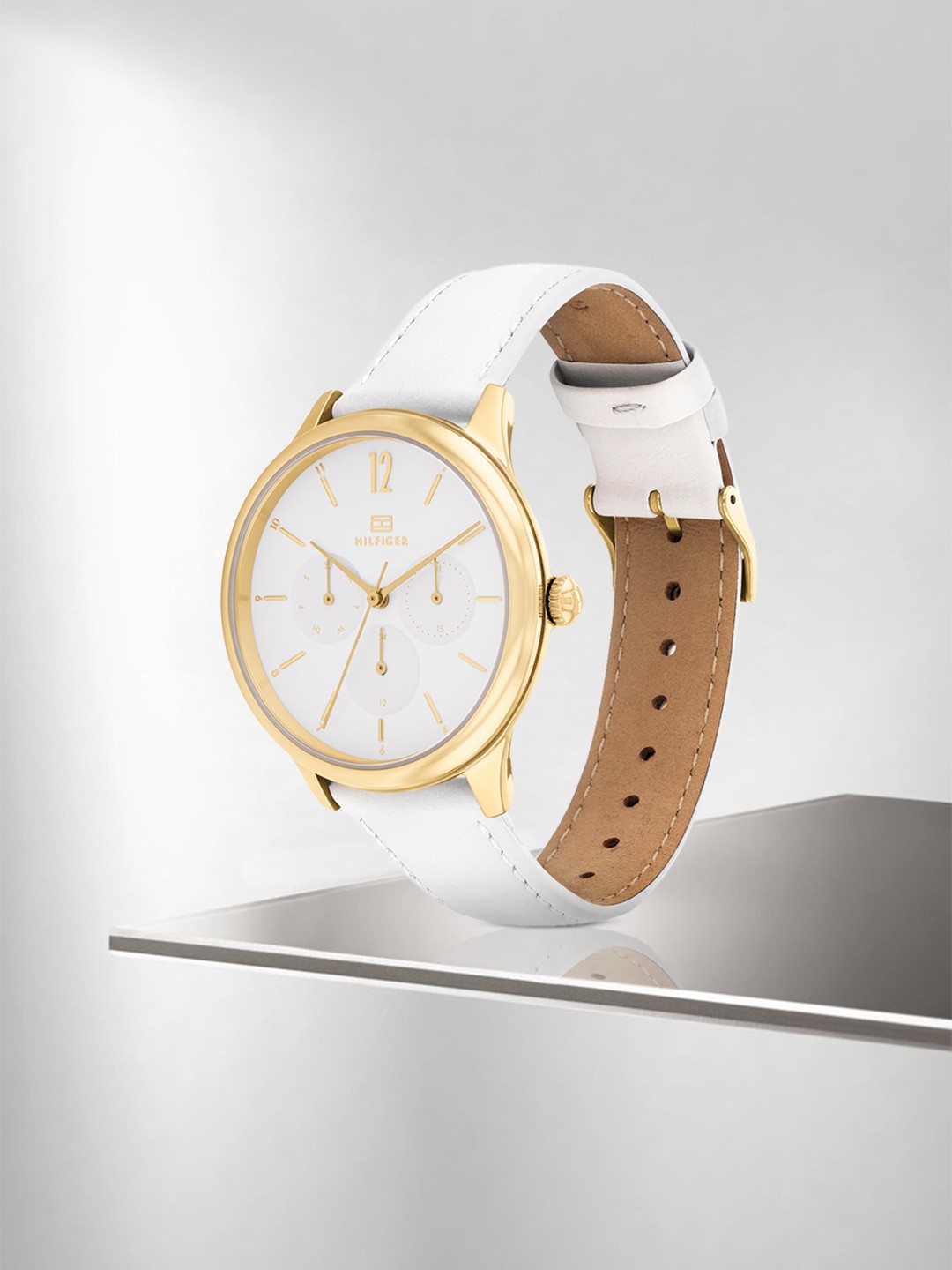 

Tommy Hilfiger Women White Dial & White Leather Straps Analogue Watch TH1782454W, Gold