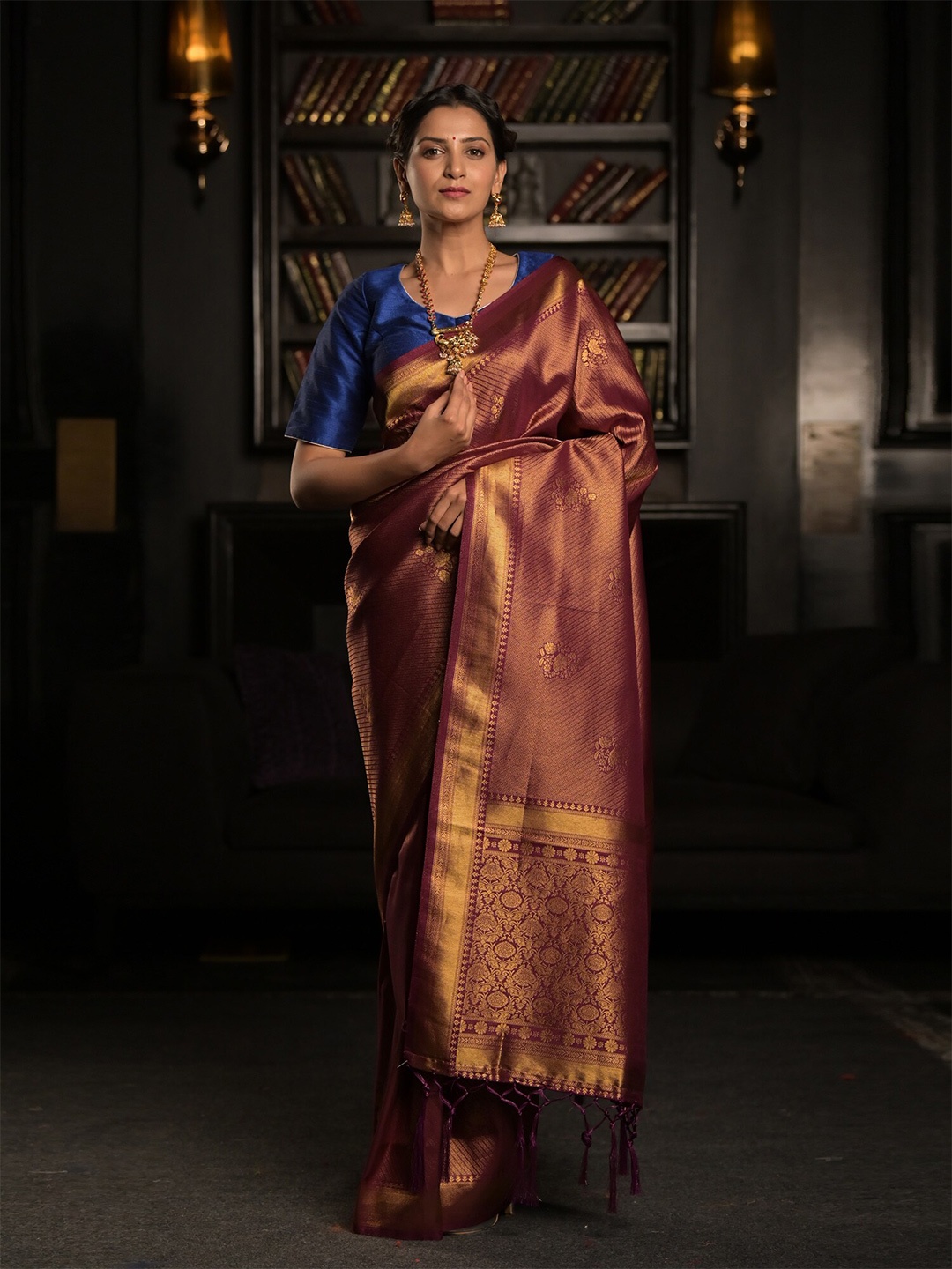 

Exclusiva Purple & Golden Woven Design Zari Silk Blend Heavy Work Saree