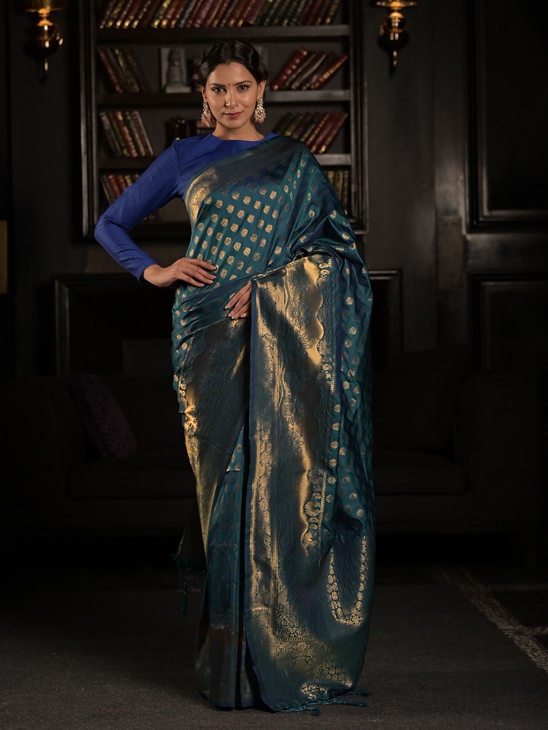 

Exclusiva Blue & Golden Floral Zari Silk Blend Saree