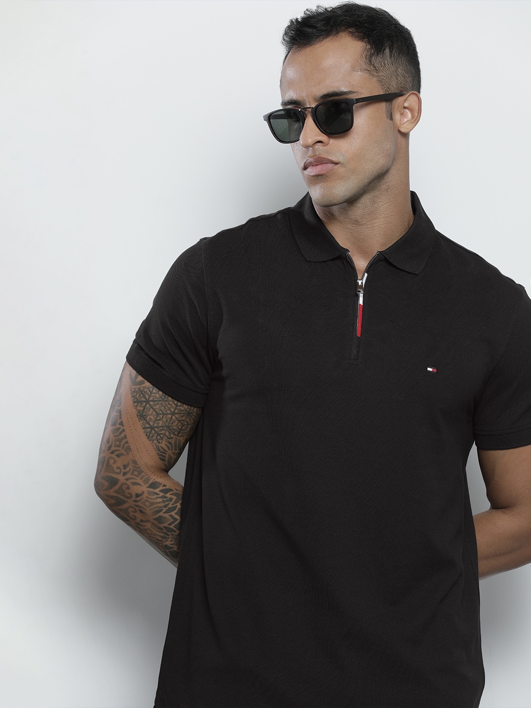 

Tommy Hilfiger Men Black Solid Polo Collar Regular Sleeves Organic Cotton T-shirt