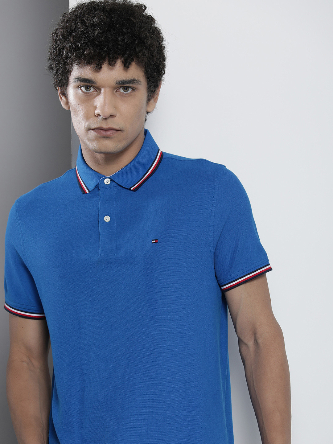 

Tommy Hilfiger Men Blue Solid Polo Collar T-shirt