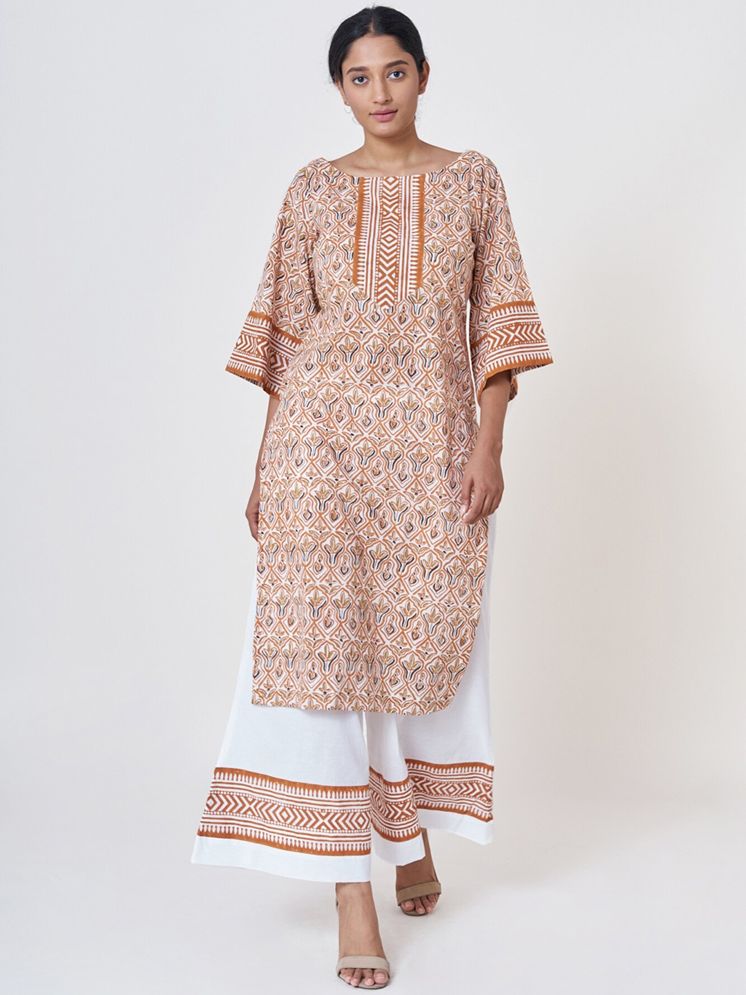 

SHRINKHLA Women Rust Floral Printed Pure Cotton Kurta with Palazzos