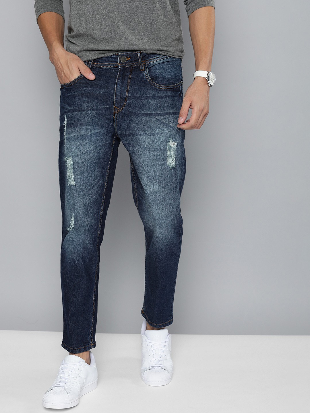 

Mast & Harbour Men Blue Carrot Slim Fit Mildly Distressed Light Fade Stretchable Jeans