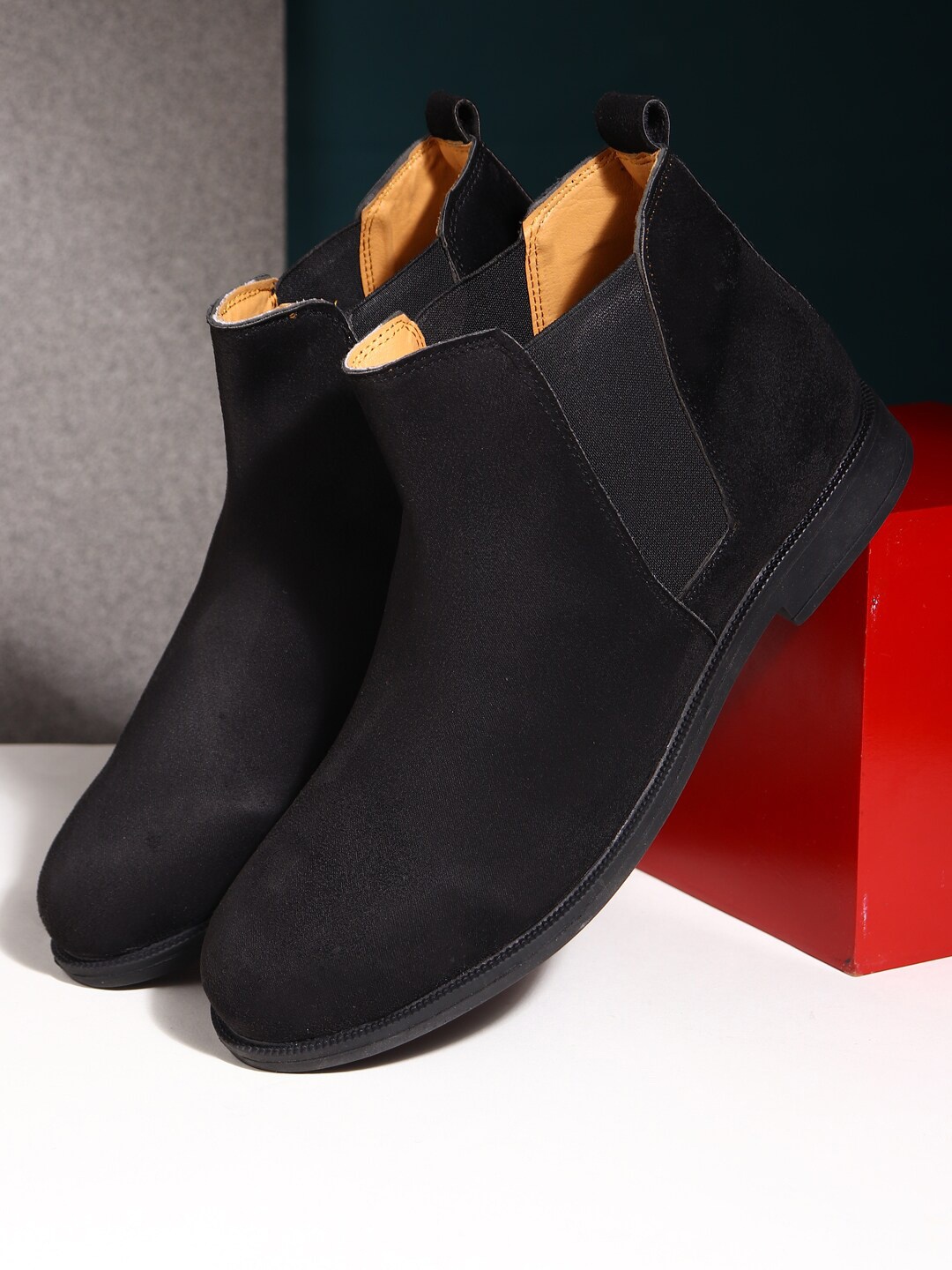 

Apsis Men Black Solid Round Toe Suede Mid-Top Chalsea Boot