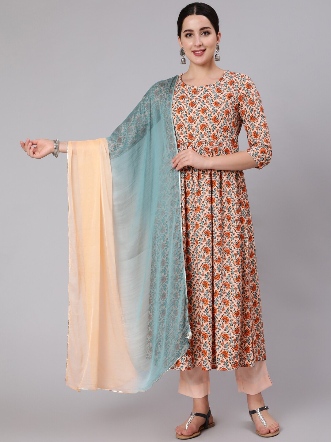 

KIMAYRA Women Peach-Coloured Printed Pleated Kurti with Trousers & With Dupatta