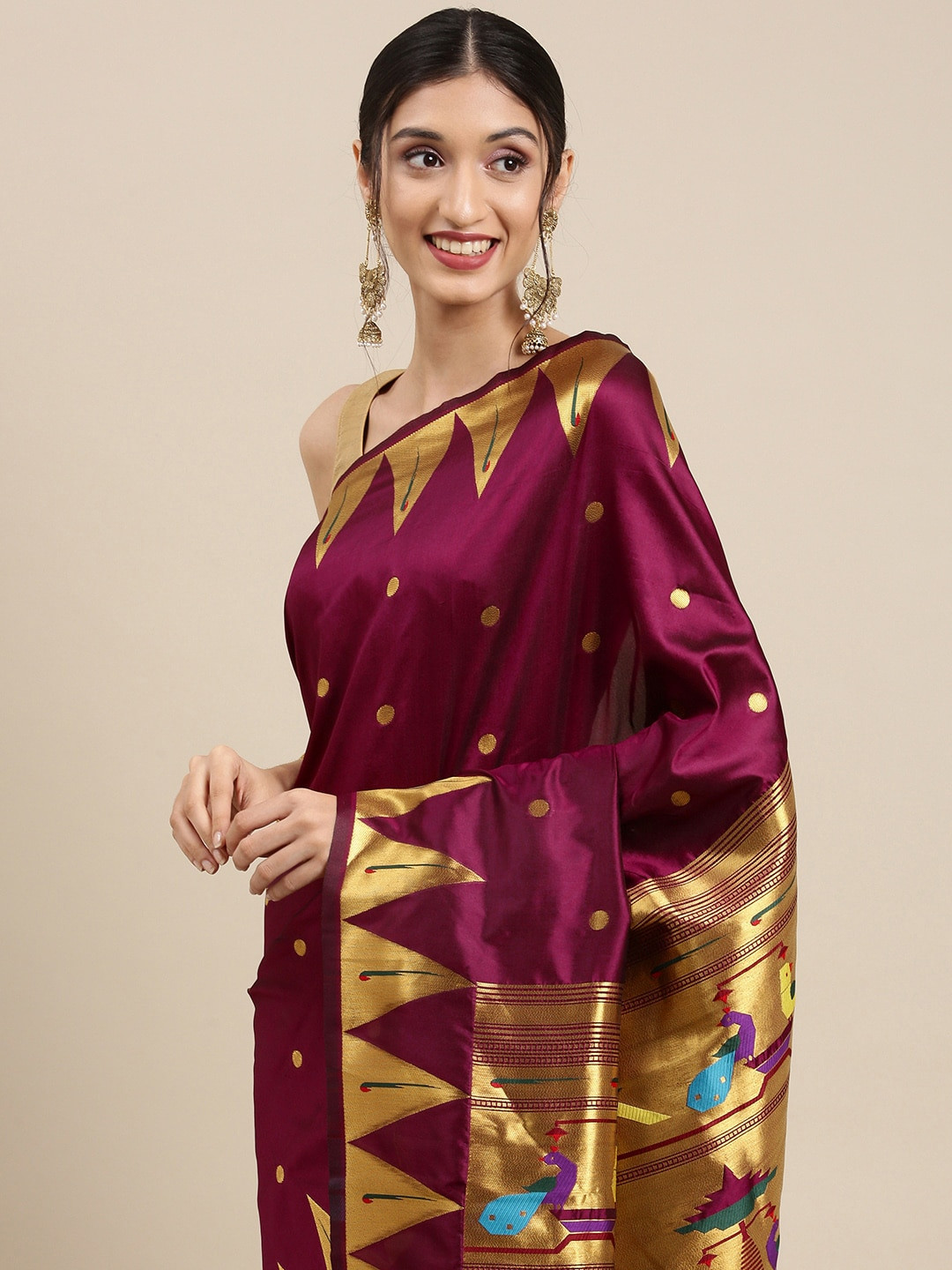 

Mitera Burgundy & Golden Ethnic Motifs Zari Silk Blend Saree