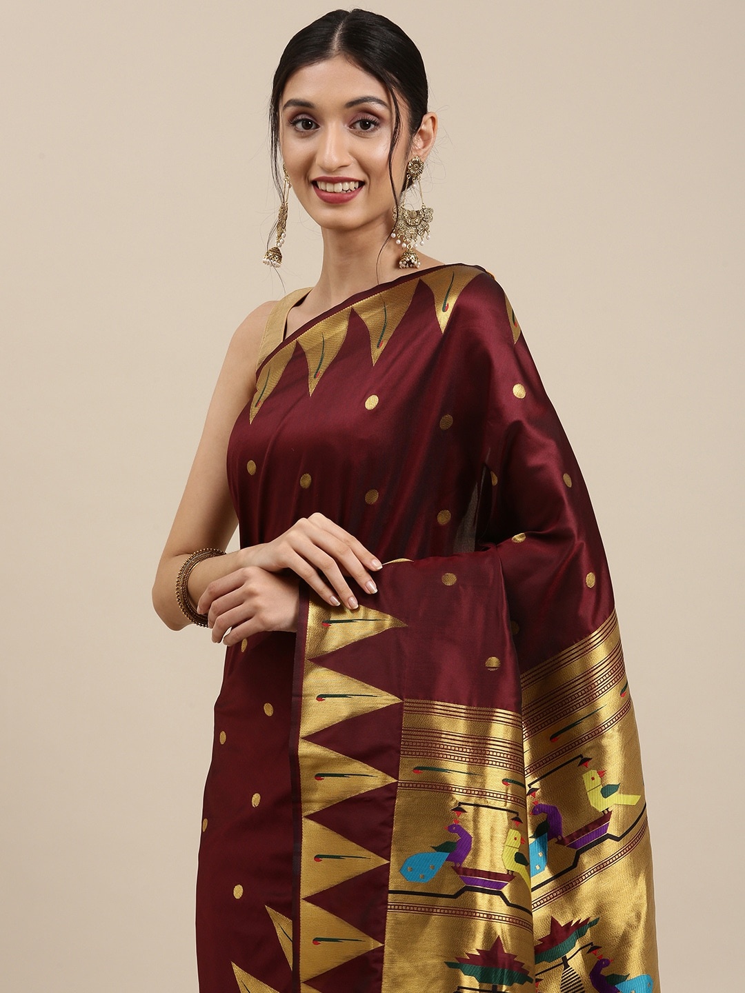 

Mitera Maroon & Golden Ethnic Motifs Silk Blend Saree