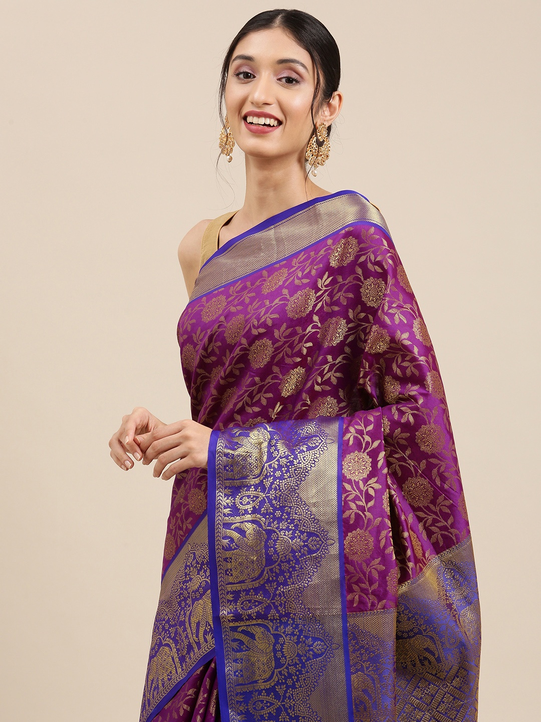 

Mitera Purple & Golden Ethnic Motifs Zari Silk Blend Kanjeevaram Saree