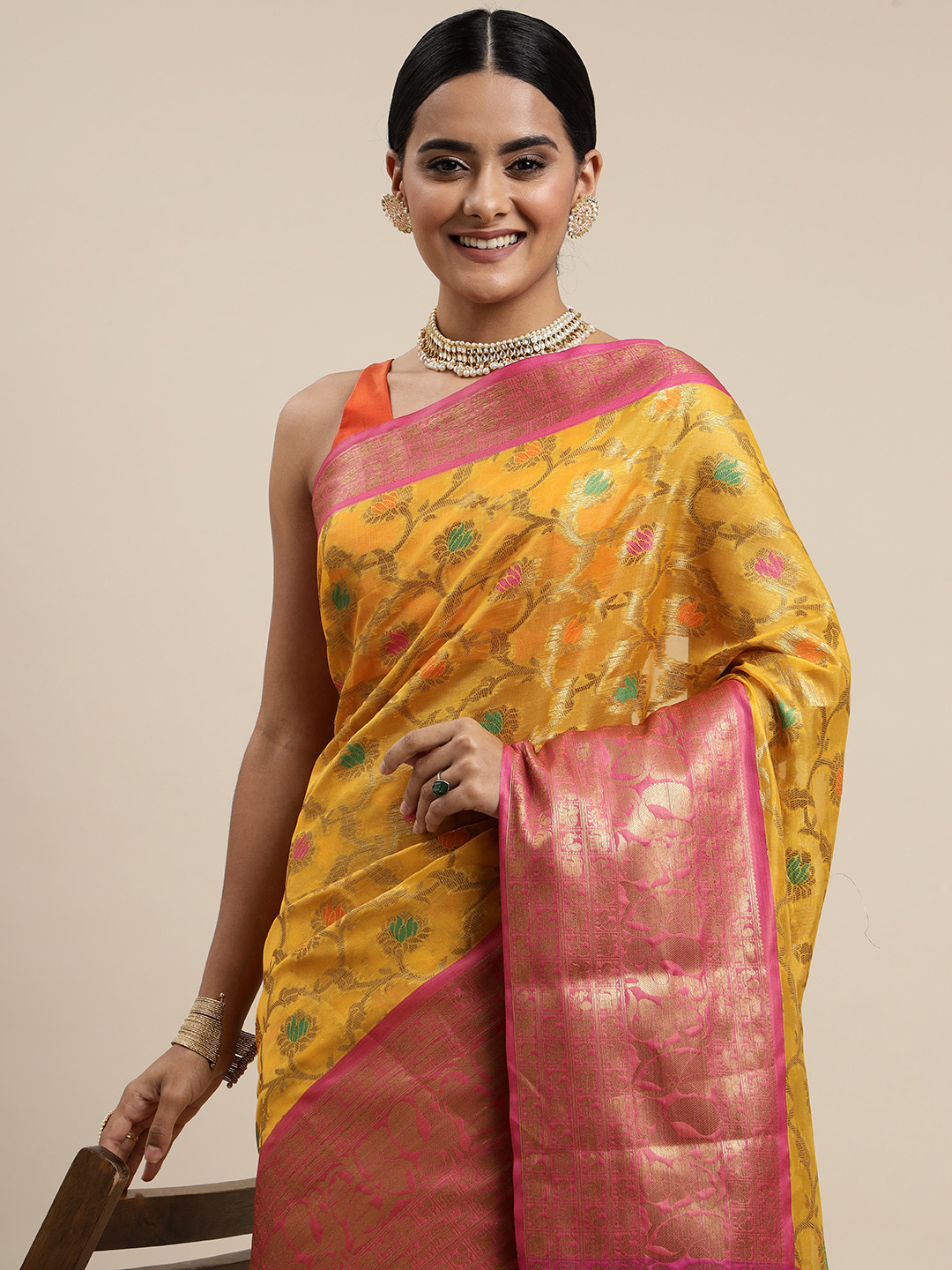 

Mitera Yellow & Peach-Coloured Ethnic Motifs Zari Organza Saree