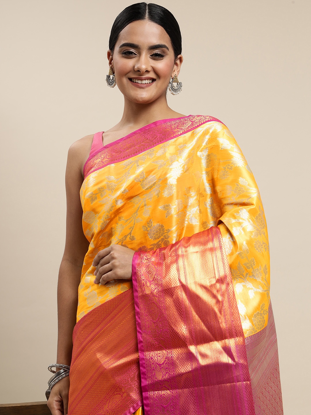 

Mitera Yellow & Orange Ethnic Motifs Zari Organza Saree