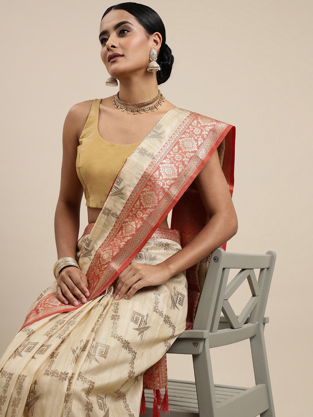 

Mitera Beige & Golden Ethnic Motifs Zari Silk Blend Banarasi Saree