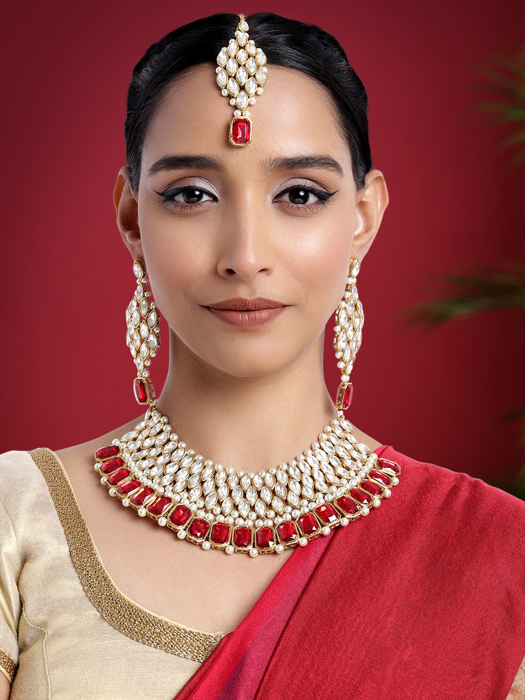 

Peora Women Maroon & White Crystal Studded Gold Plated Jewellery Set