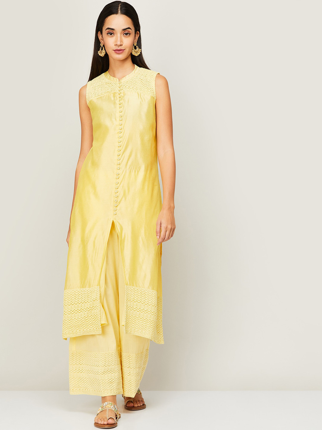

Melange by Lifestyle Women Yellow Embroidered Panelled Kurti with Trousers