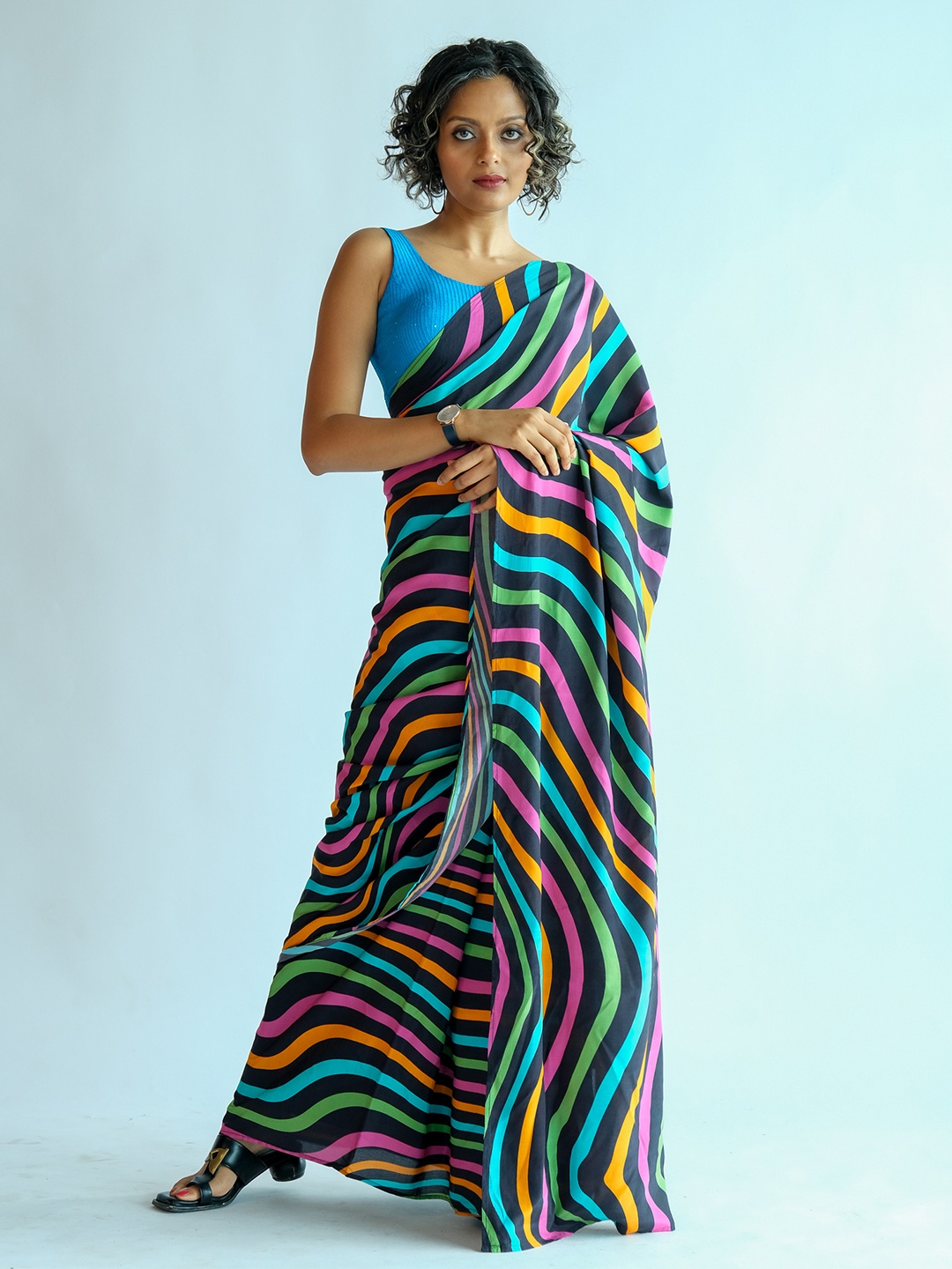 

Suta Black & Blue Striped Saree