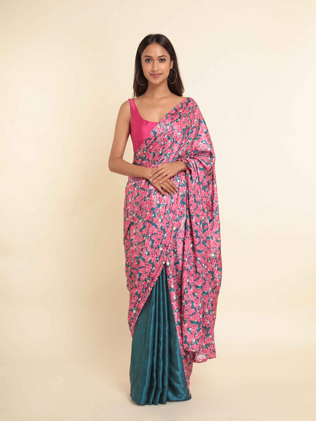 

Suta Pink & Teal Floral Printed Zari Saree