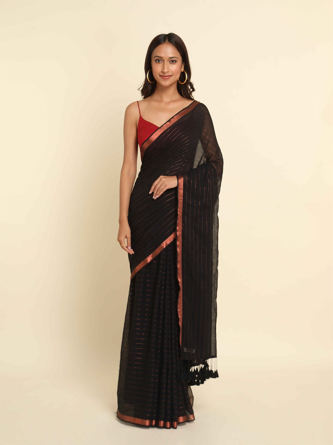 

Suta Women Black & Copper-Toned Striped Saree