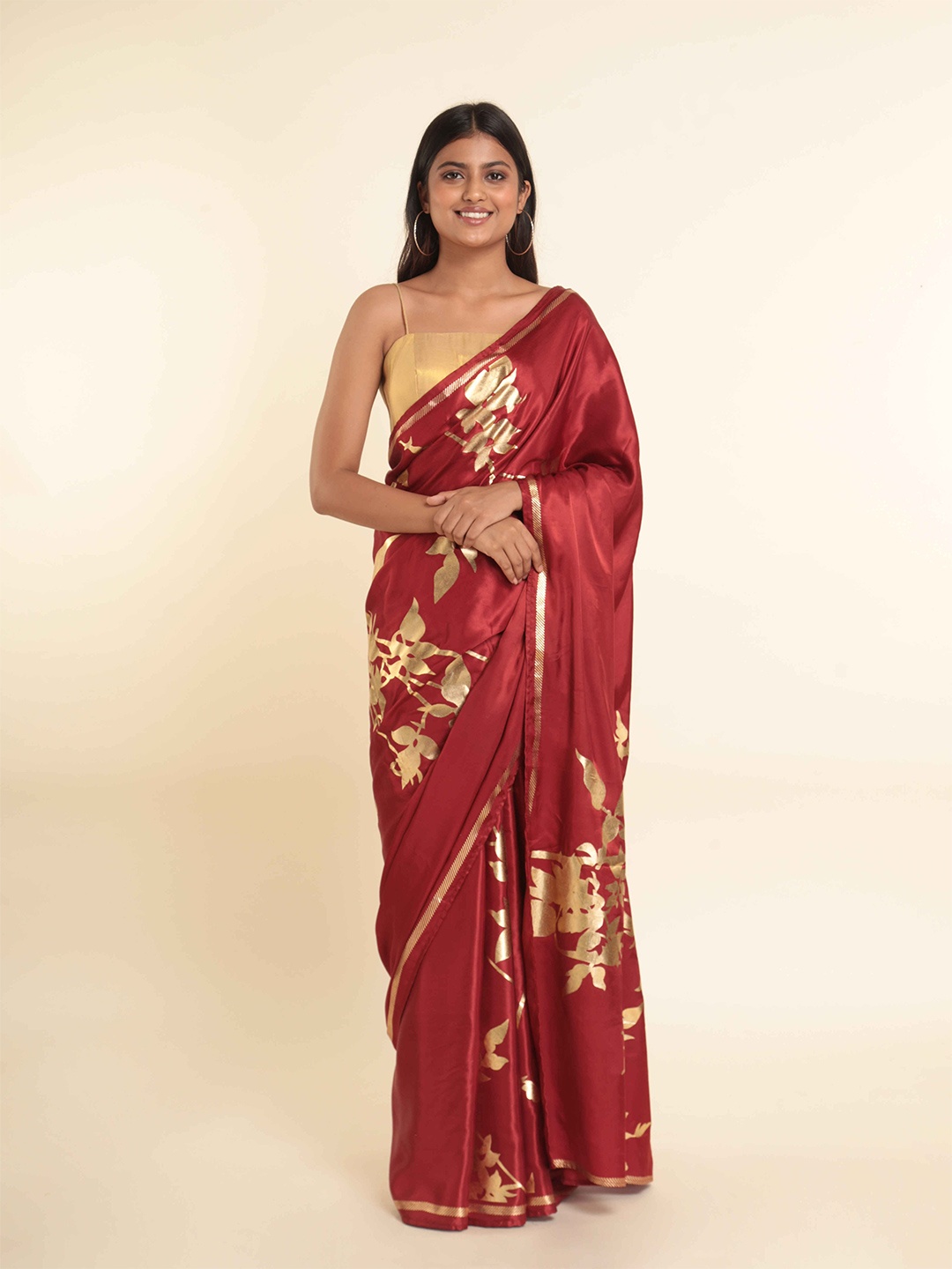 

Suta Maroon & Gold-Toned Floral Zari Saree