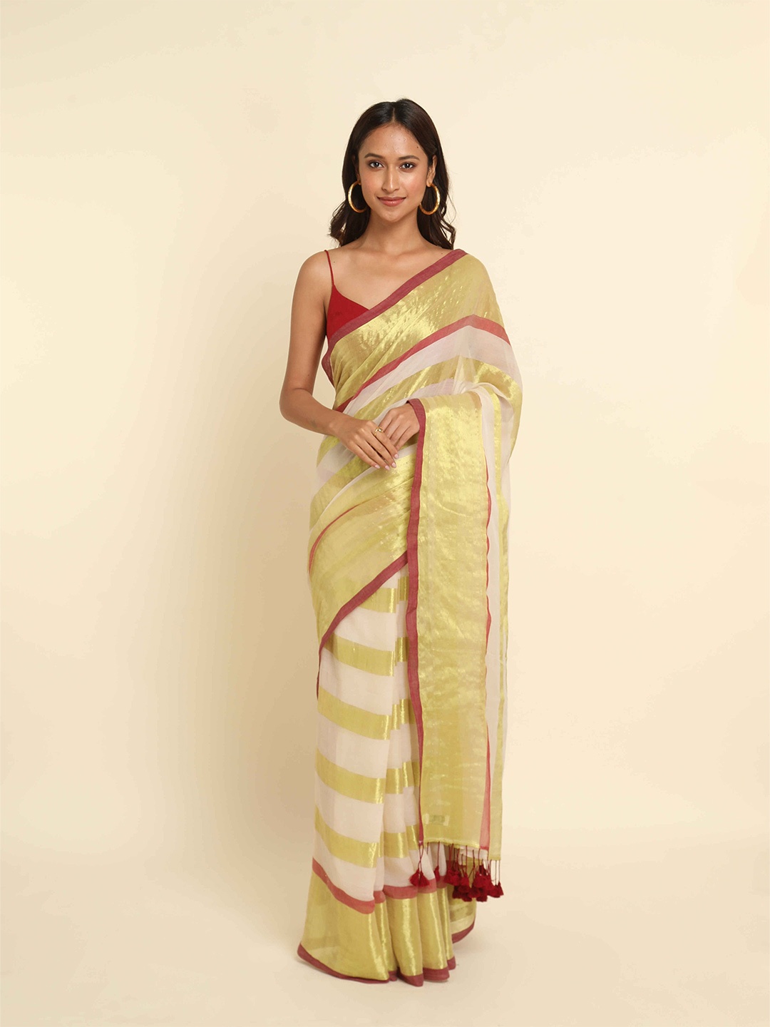 

Suta Off White & Golden Striped Saree