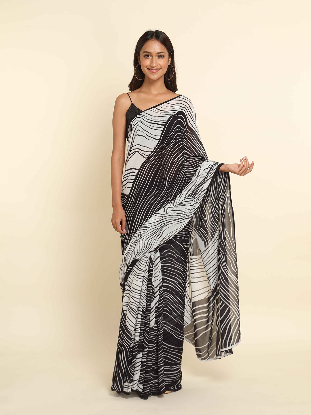 

Suta White & Black Printed Liva Saree