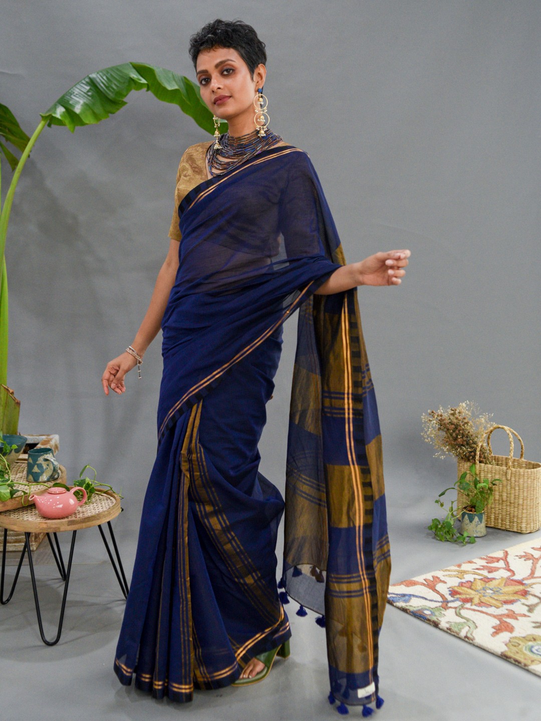 

Suta Blue & Golden Zari Saree