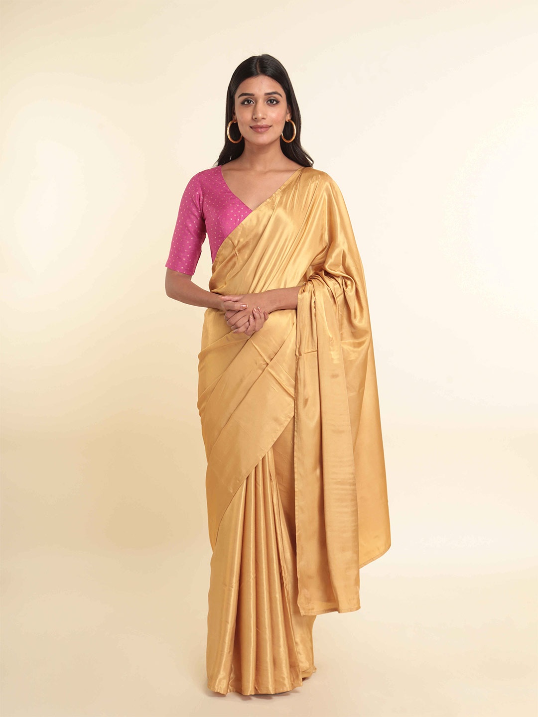 

Suta Women Gold-Toned Solid Saree