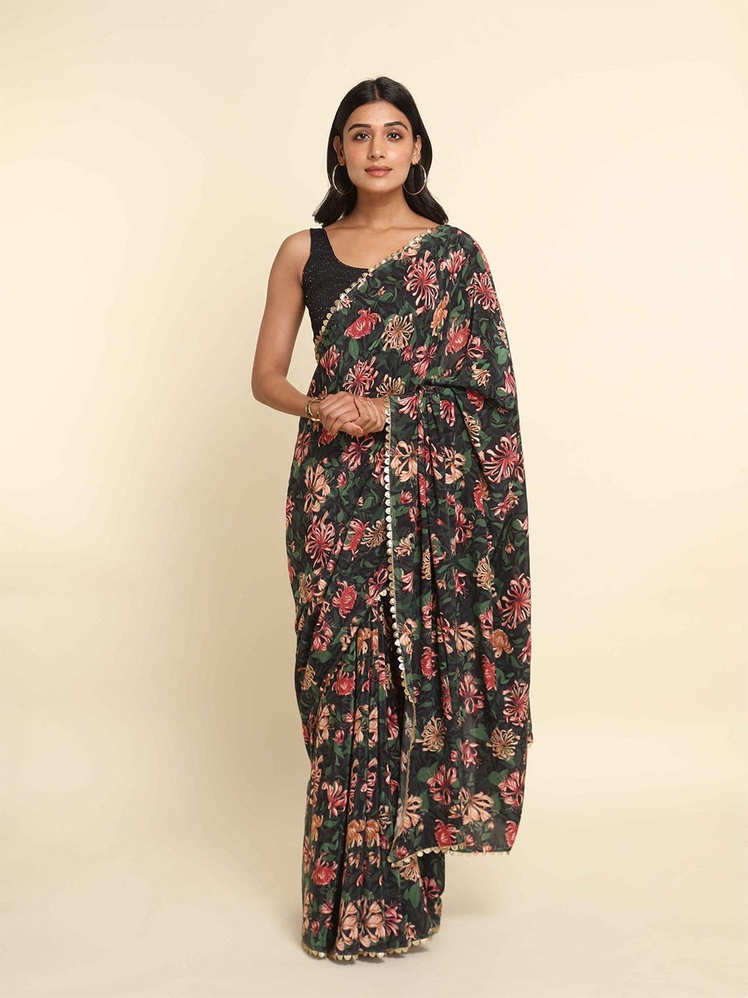

Suta Green & Red Floral Saree
