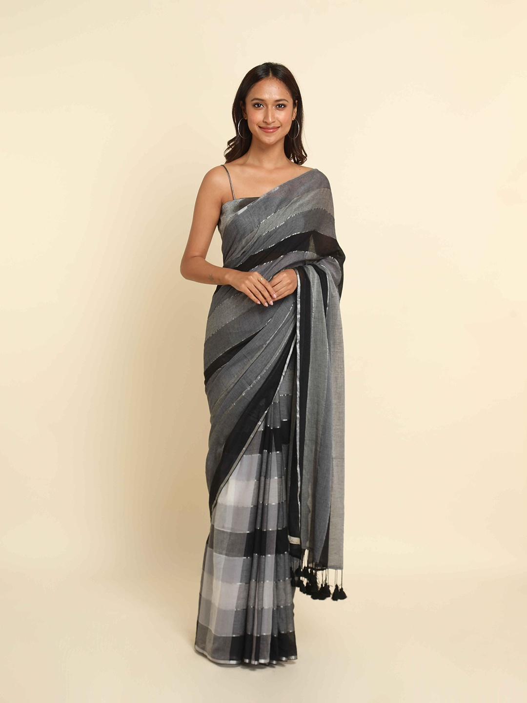 

Suta Black & Grey Striped Cotton Blend Saree