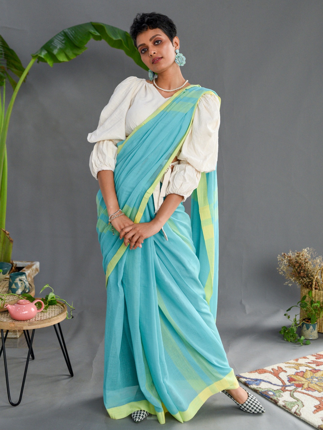 

Suta Turquoise Blue & Yellow Striped Pure Cotton Saree