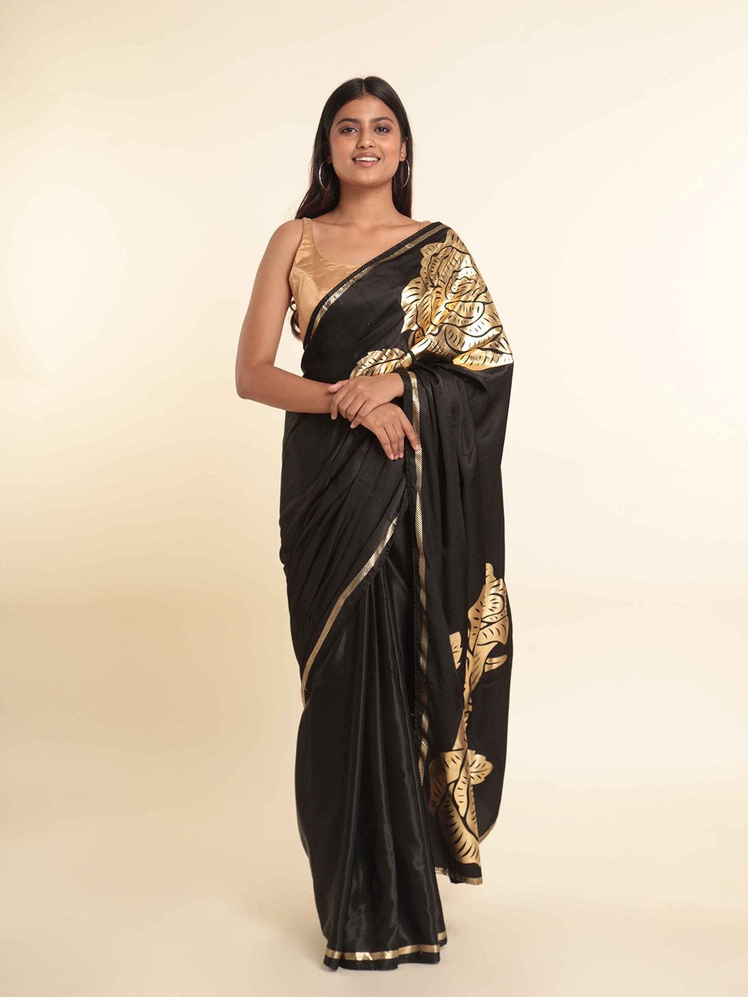 

Suta Black & Gold-Toned Floral Saree