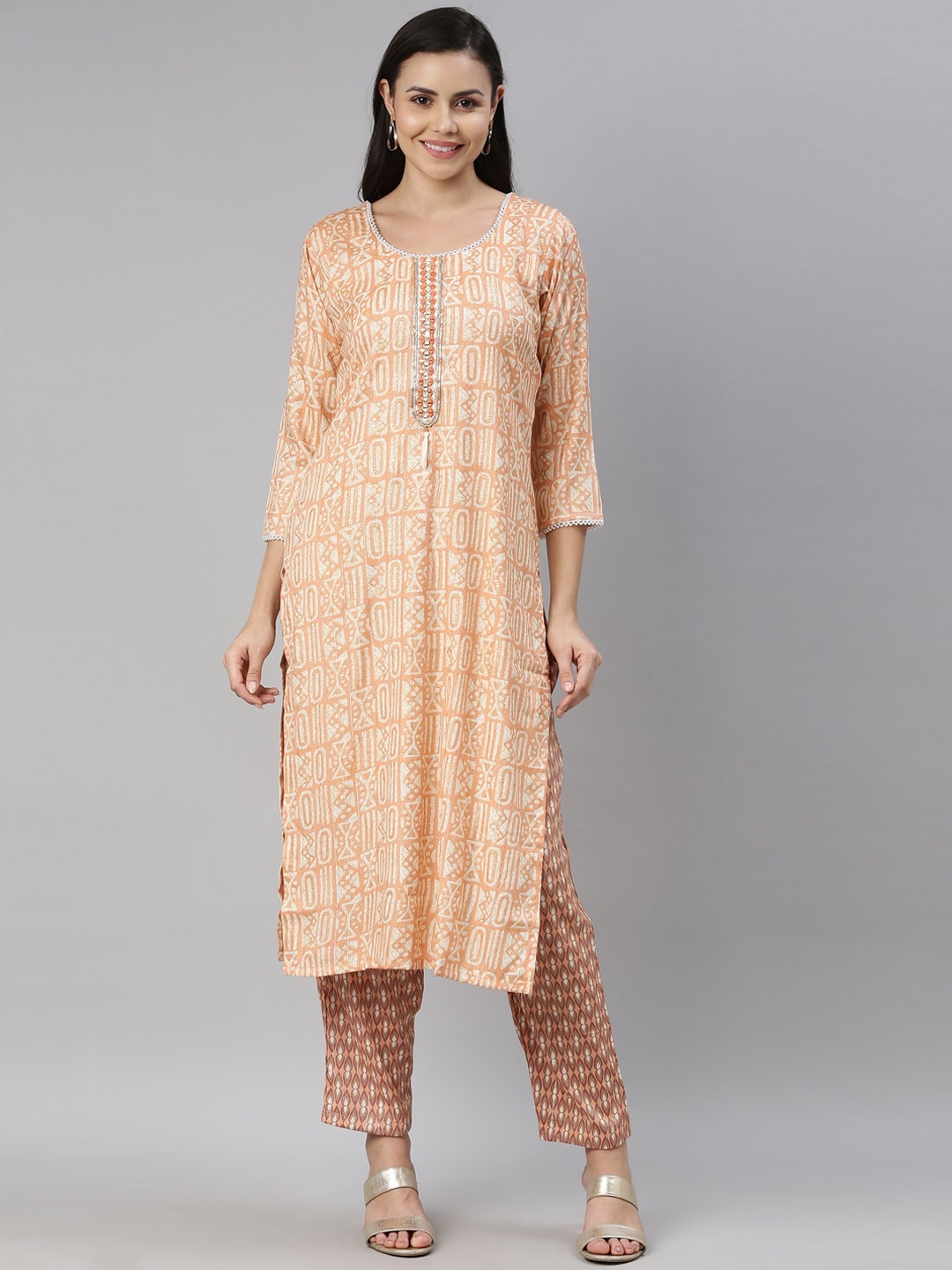 

Neerus Women Orange Printed Beads and Stones Kurti with Trousers