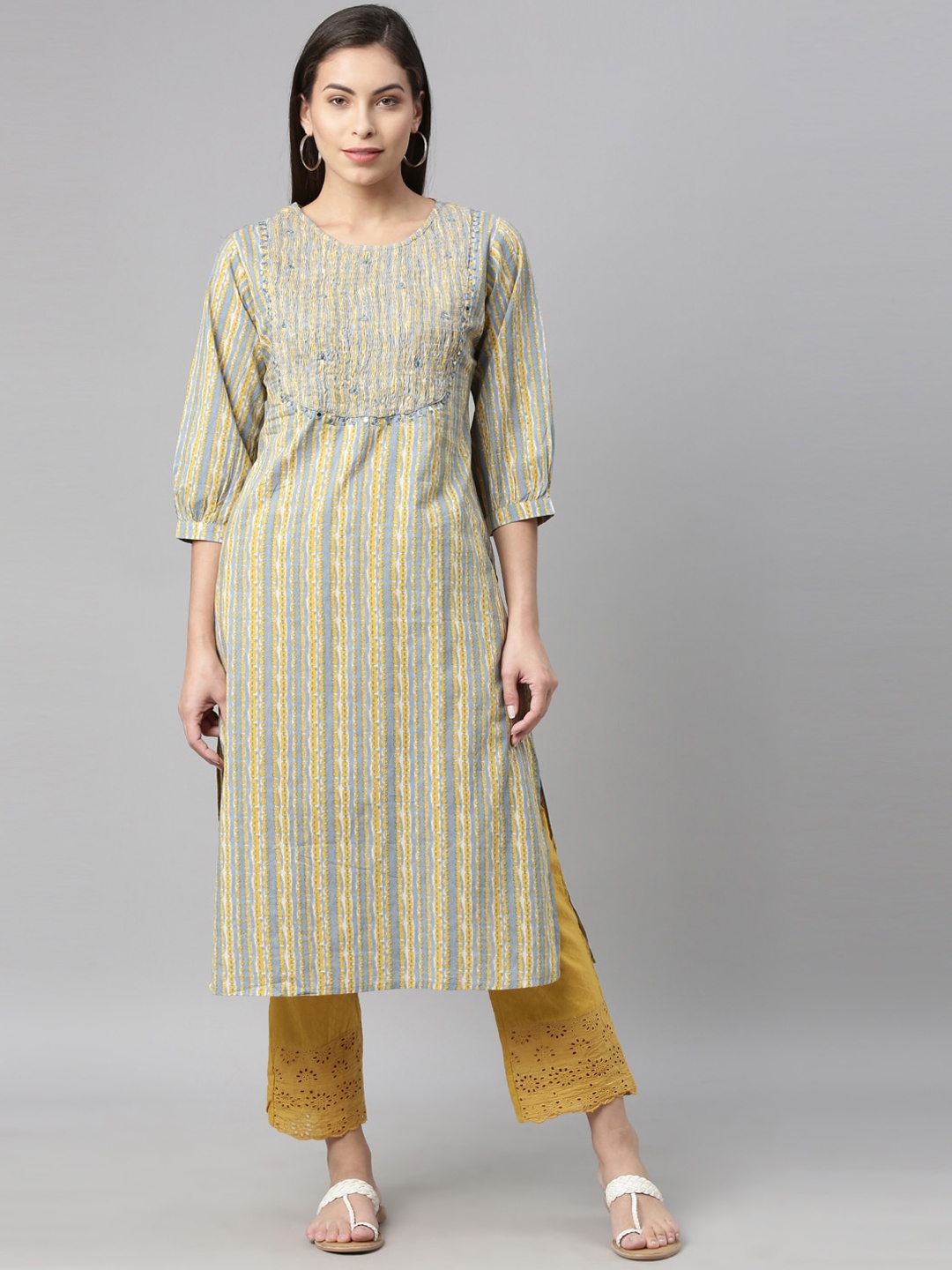 

Neerus Women Blue & Yellow Printed Mirror Work Kurta with Trousers