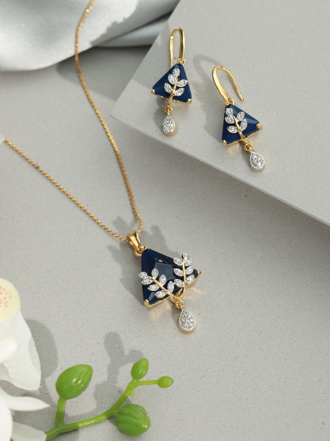 

Priyaasi Women Gold Plated Blue Triangular Floral AD Studded Jewellery Set