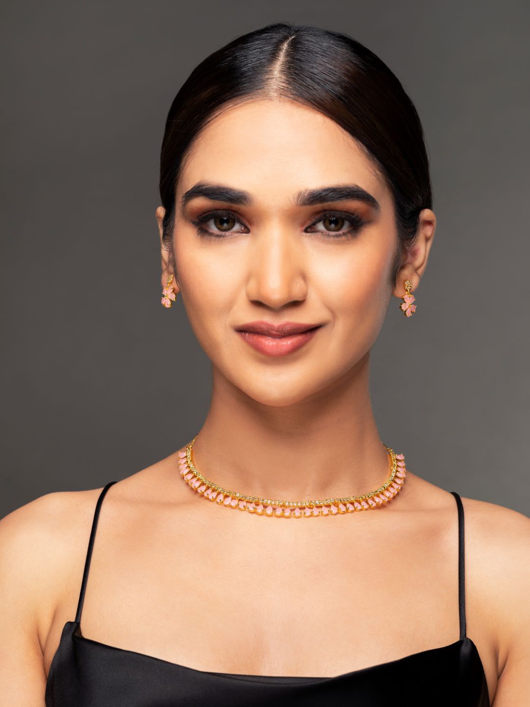 

Priyaasi Women Gold-Plated Pink Floral Leaf AD Studded & Beaded Jewellery Set