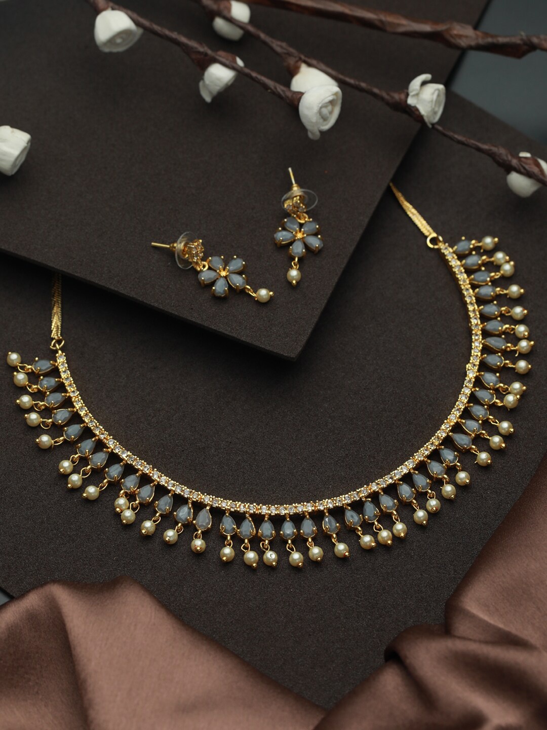 

Priyaasi Gold-Plated Grey & White Stone-Studded & Pearl-Beaded Jewellery Set