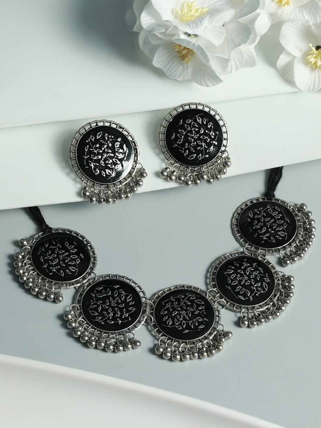 

Priyaasi Oxidised Silver Round Black Floral Jewellery Set