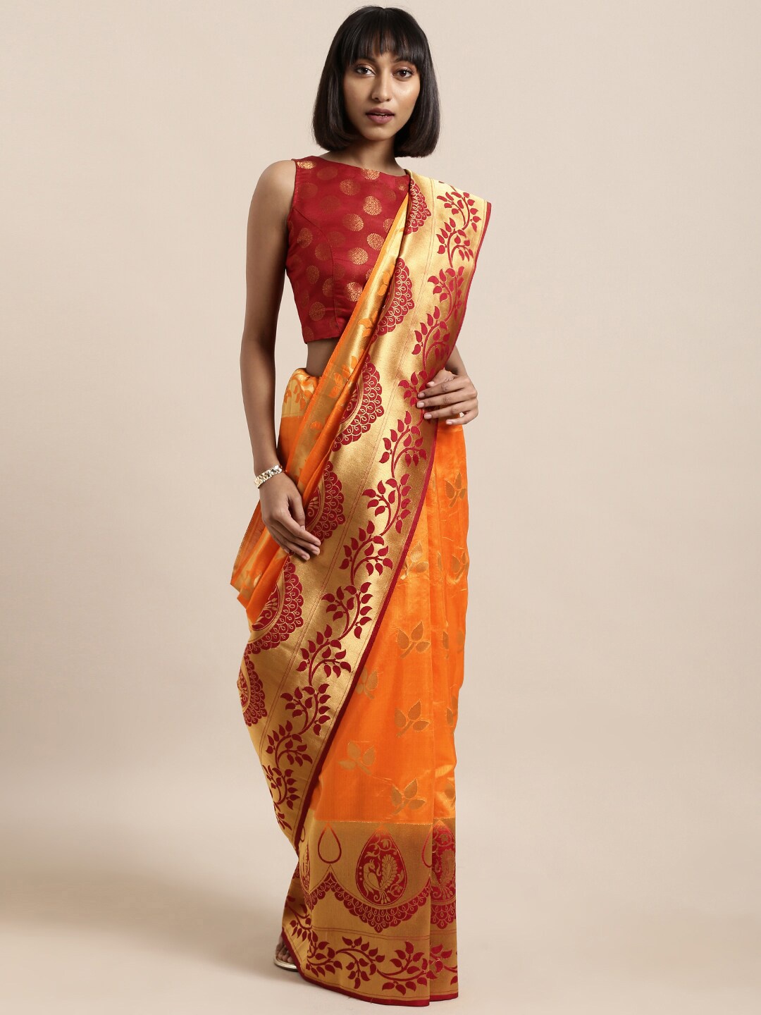 

Shaily Orange & Maroon Ethnic Motifs Zari Silk Cotton Kanjeevaram Saree