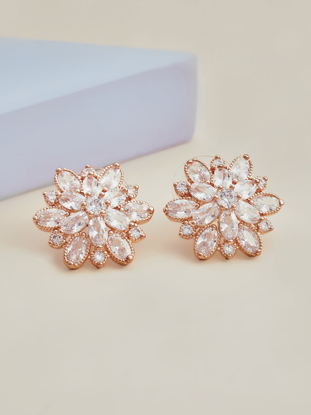 

Kushal's Fashion Jewellery White Floral Cubic Zirconia Studded Studs Earrings