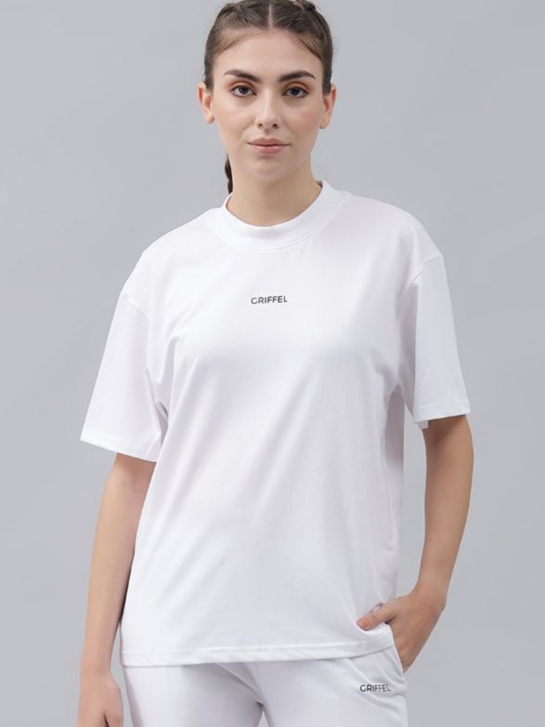 

GRIFFEL Women White Solid Sports T-shirt