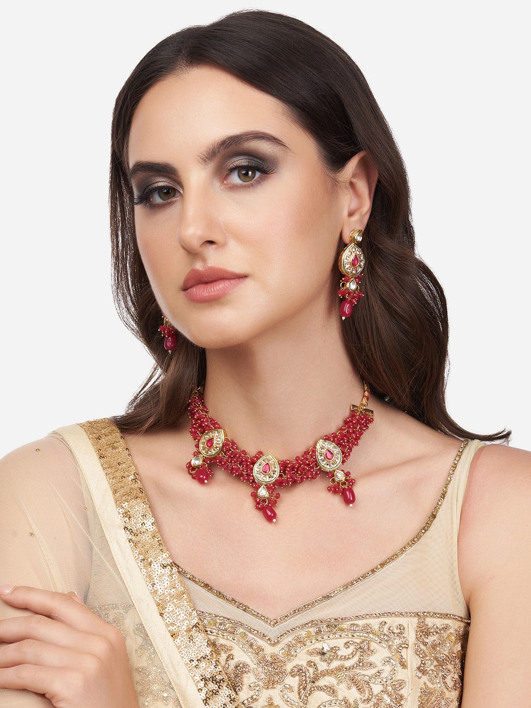 

Zaveri Pearls Gold-Plated White Kundan Studded & Red Beaded Jewellery Set