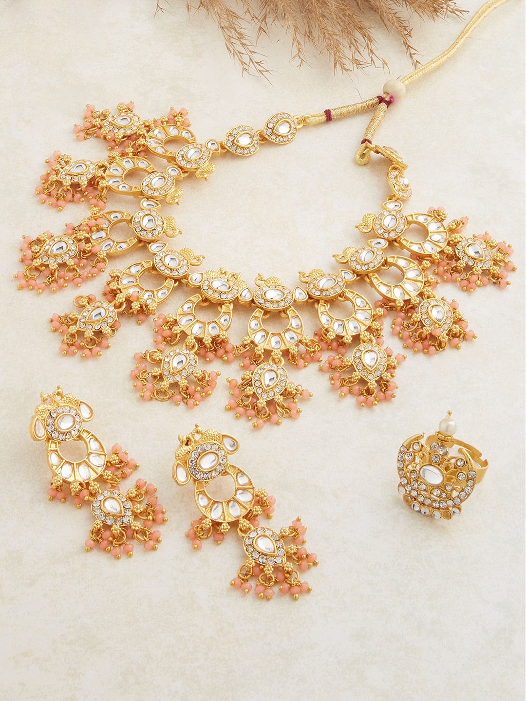 

Zaveri Pearls Gold-Plated & White Stone-Studded Peach JewellerySet