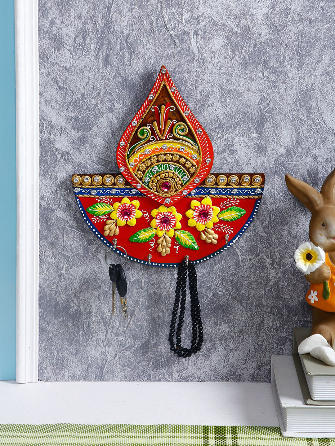 

Aapno Rajasthan Red & Yellow Diya Design Key Hanger