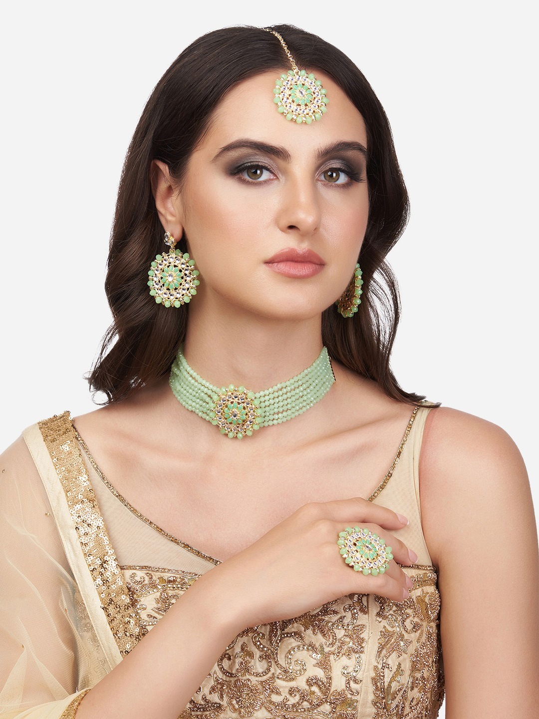 

Zaveri Pearls Gold-Plated White Crystal Studded & Green Beaded Jewellery Set