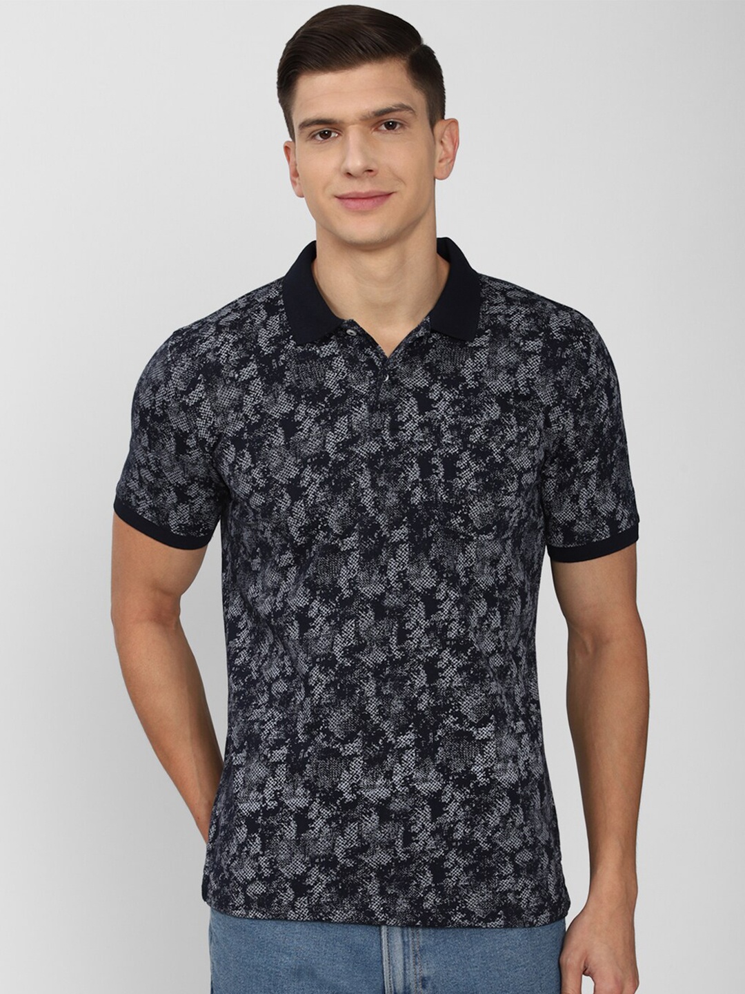 

Peter England Casuals Men Navy Blue & White Printed Polo Collar T-shirt