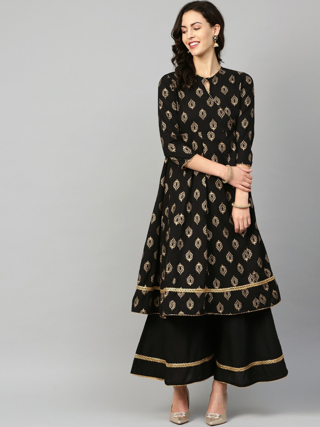 

Bhama Couture Women Black Ethnic Motifs Printed Kurta with Palazzos