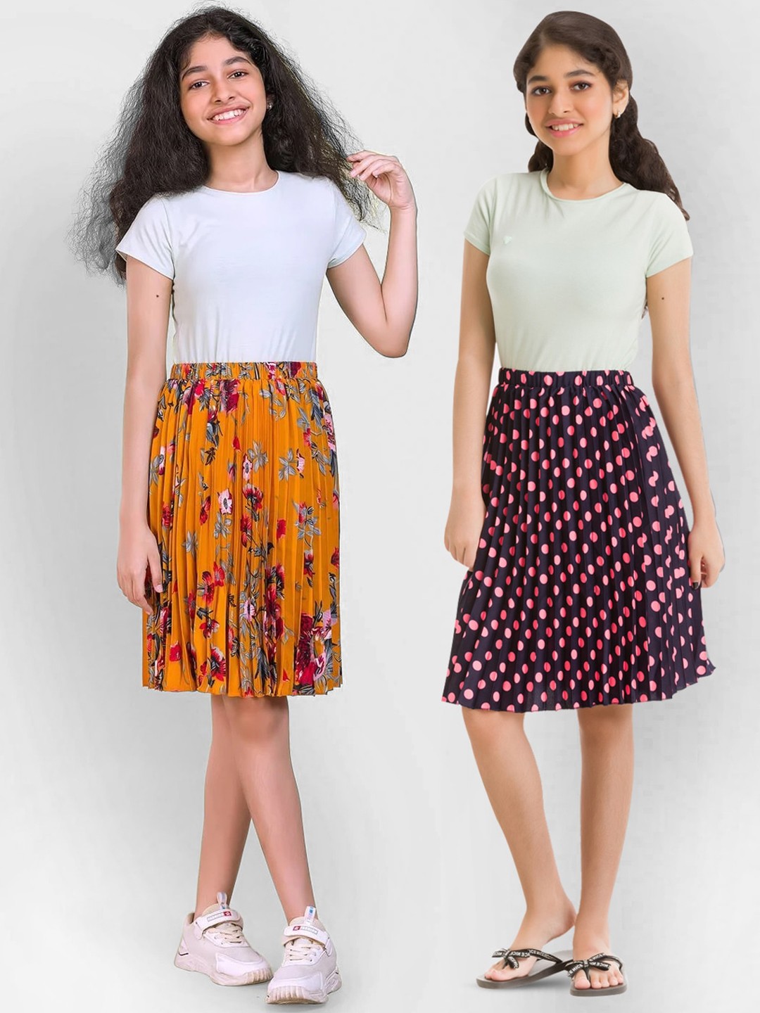 

Uptownie Lite Girls Pack of 2 Black & Orange Printed Midi Pleated Skirts