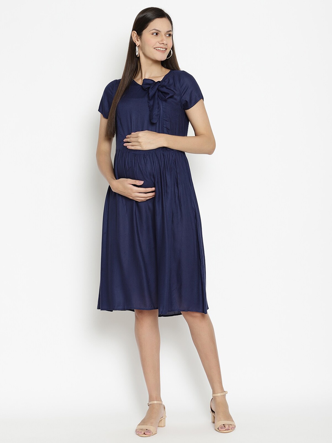 

The Vanca Women Navy Blue Solid Tie-Up Neck Maternity Fit & Flare Dress