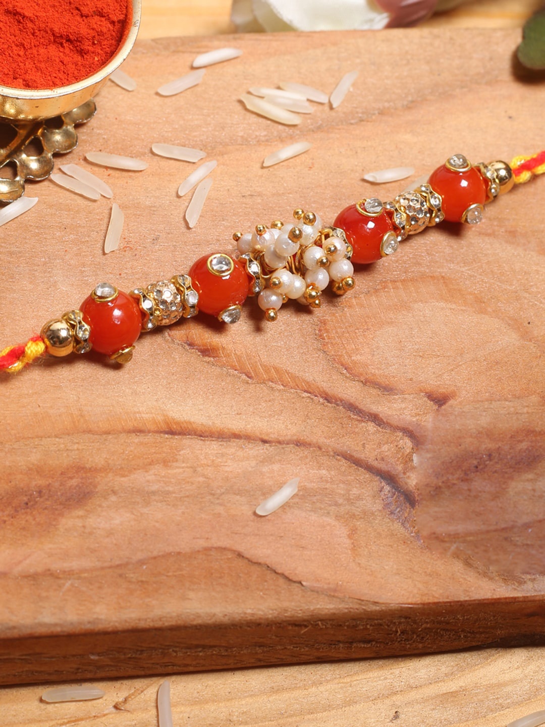 

Aapno Rajasthan Red & White Beaded Mauli Rakhi
