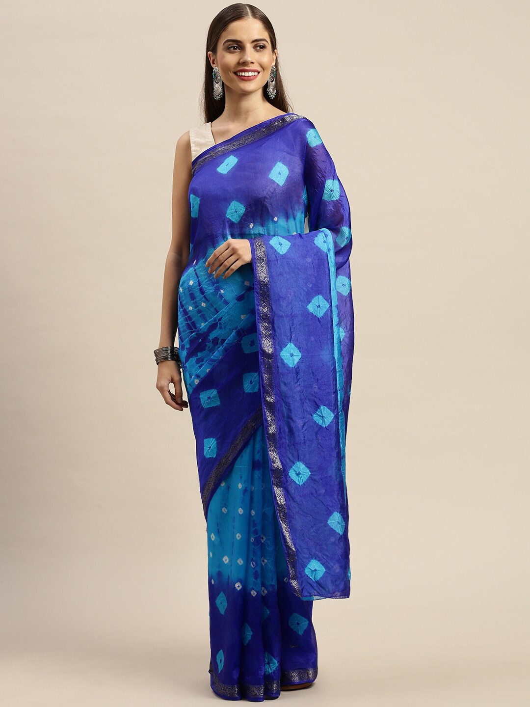 

Geroo Jaipur Turquoise Blue & White Bhandani Print Art Silk Saree